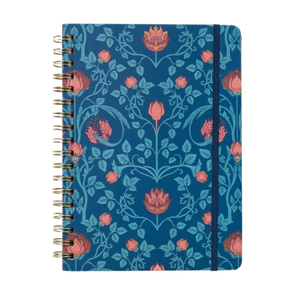 Front of Spiral notebook with an elastic to hold it closed, a royal blue background with a fine type flower design, vines being a light blue and the flowers a rusty pink